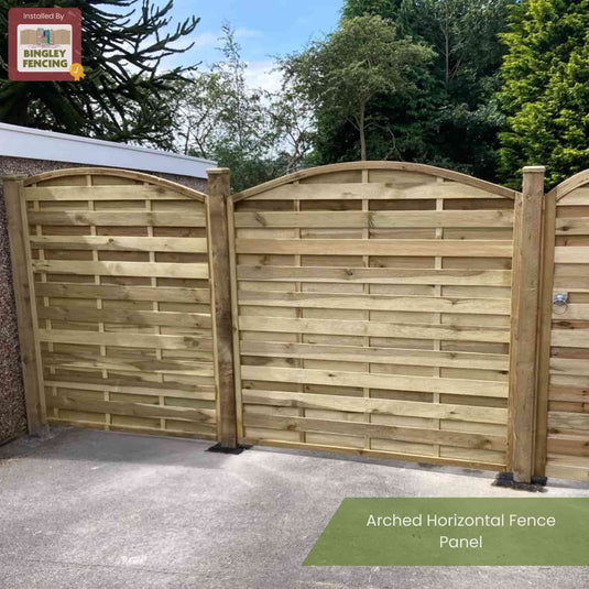 A wooden KDM Arched Horizontal Fence Panel - AH180 made from pressure-treated timber features arched horizontal panels, installed in a lush garden. The top left shows the KDM logo; below, the text reads Arched Horizontal Fence Panel - AH180.