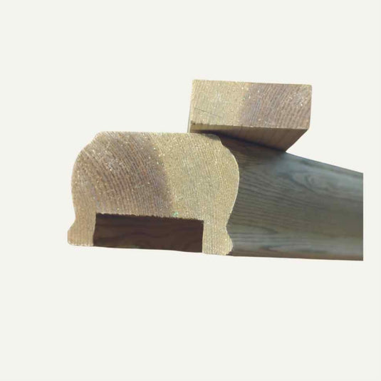 Close-up of two KDM Premier Handrail & Fillet System pieces, each with intricate side profiles reminiscent of balustrade components. They are positioned in a stacked manner against a light background, showcasing their craftsmanship.