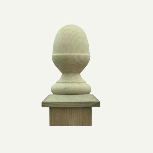 The KDM Fence Post Finial - Acorn Style features a smooth, rounded design with a decorative finial mounted on a square base. Its light, natural finish highlights intricate grain patterns against a plain background, making it an ideal accent for any setting.