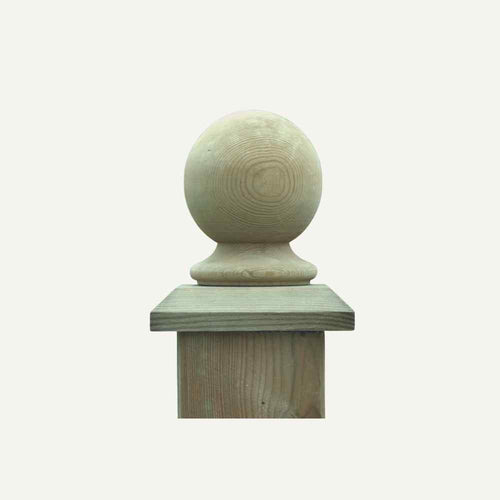 Displayed against a plain white background is the KDM "Fence & Baluster Top - Round Style," featuring a smooth, round decorative finial on top. The visible wood grain adds to its natural charm, typically seen atop garden fences.