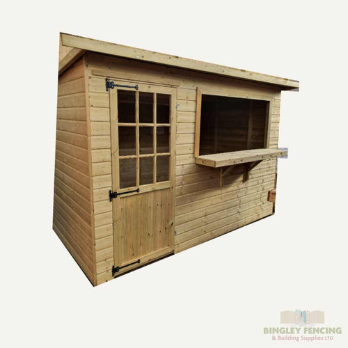 The Georgian Garden Bar by Bingley Fencing is a wooden shed with a side serving hatch and delightful Georgian windows, ideal for use as a garden bar. Its hinged door adds to its elegant appearance against a white background, while the Bingley Fencing logo in the bottom corner guarantees it's weather-proofed for enduring quality.