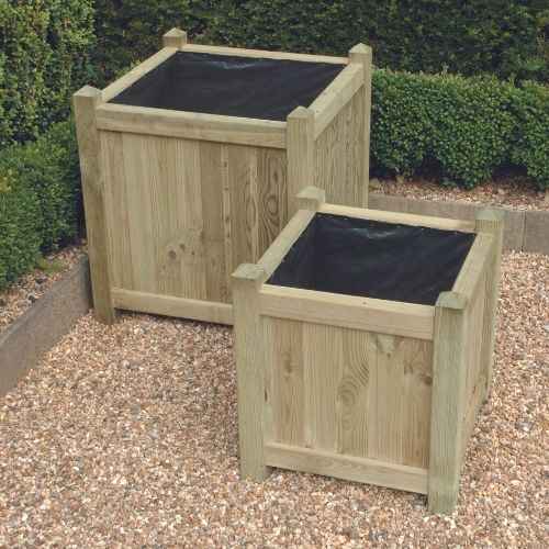 two wooden planters on patio area with full lining