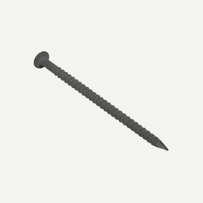 A close-up of a single dark gray Annular Ring Shank nail by Sitemate, measuring 40mm x 2.65mm with a flat head and grooves, positioned diagonally against a plain light background. Ideal for fastening MDF and plywood thanks to its superior withdrawal resistance.