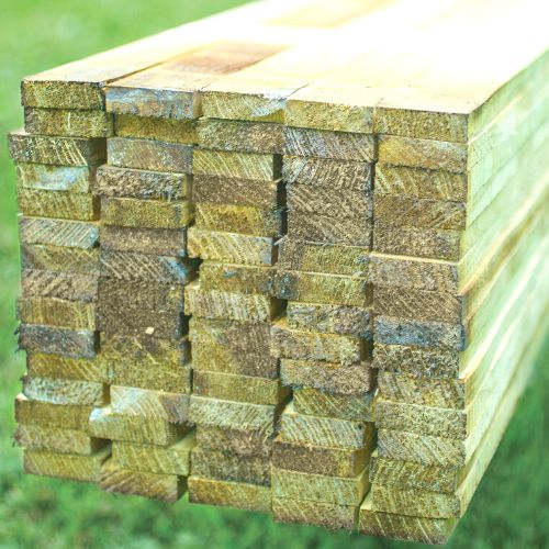 fence panel extension kit - stack of wooden strips used for fence manufacture
