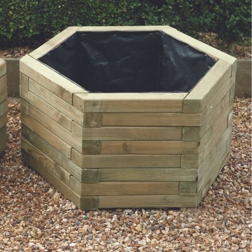 Load image into Gallery viewer, hexagonal wooden planters sat on gravel patio
