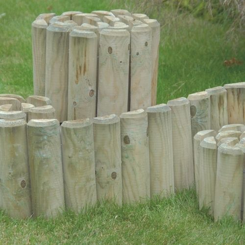 rolls of wooden logs to separate garden areas