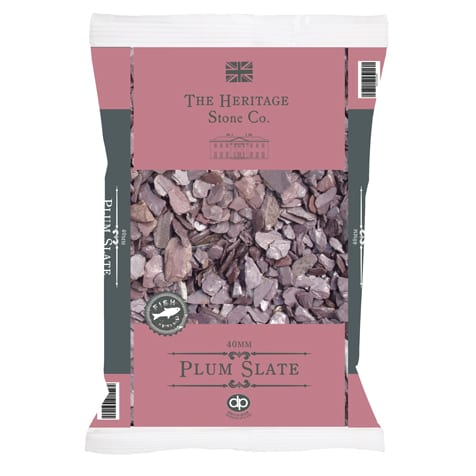 A 20kg bag of Plum Slate from The Heritage Stone Company, featuring 40mm decorative plum slate chips. The packaging displays a British flag logo and is ideal for enhancing your outdoor space.