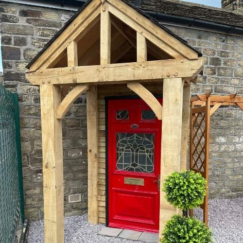 Load image into Gallery viewer, wooden entrance porch in solid oak with 4 legs and a pitched roof side view
